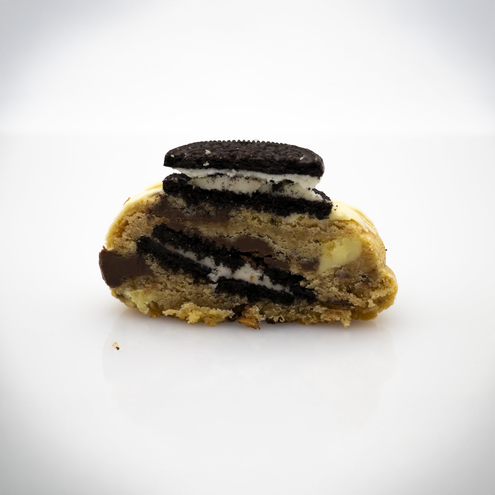 Oreo cookie broken open, showing the soft centre