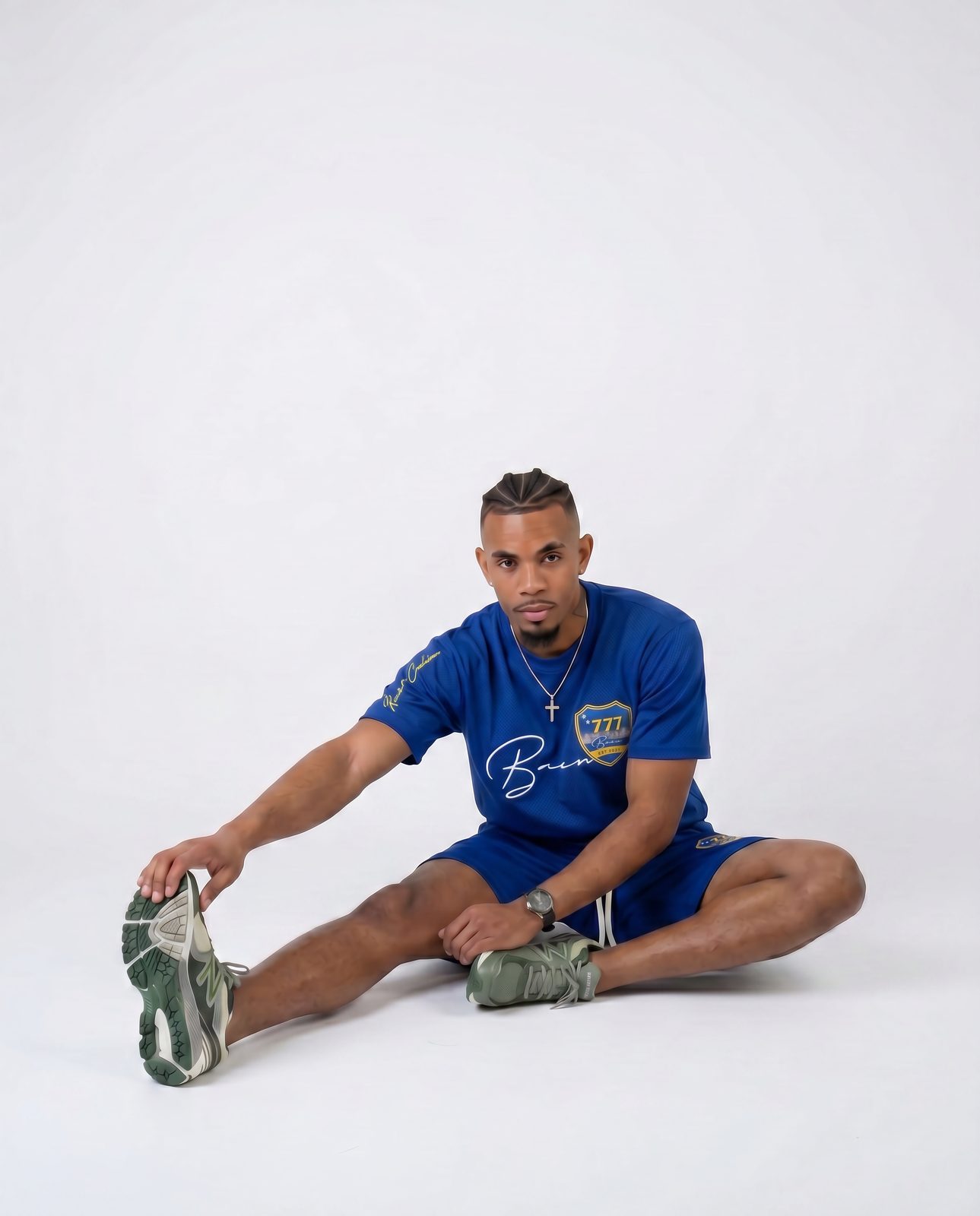 Model stretching in a blue BACU tee and shorts