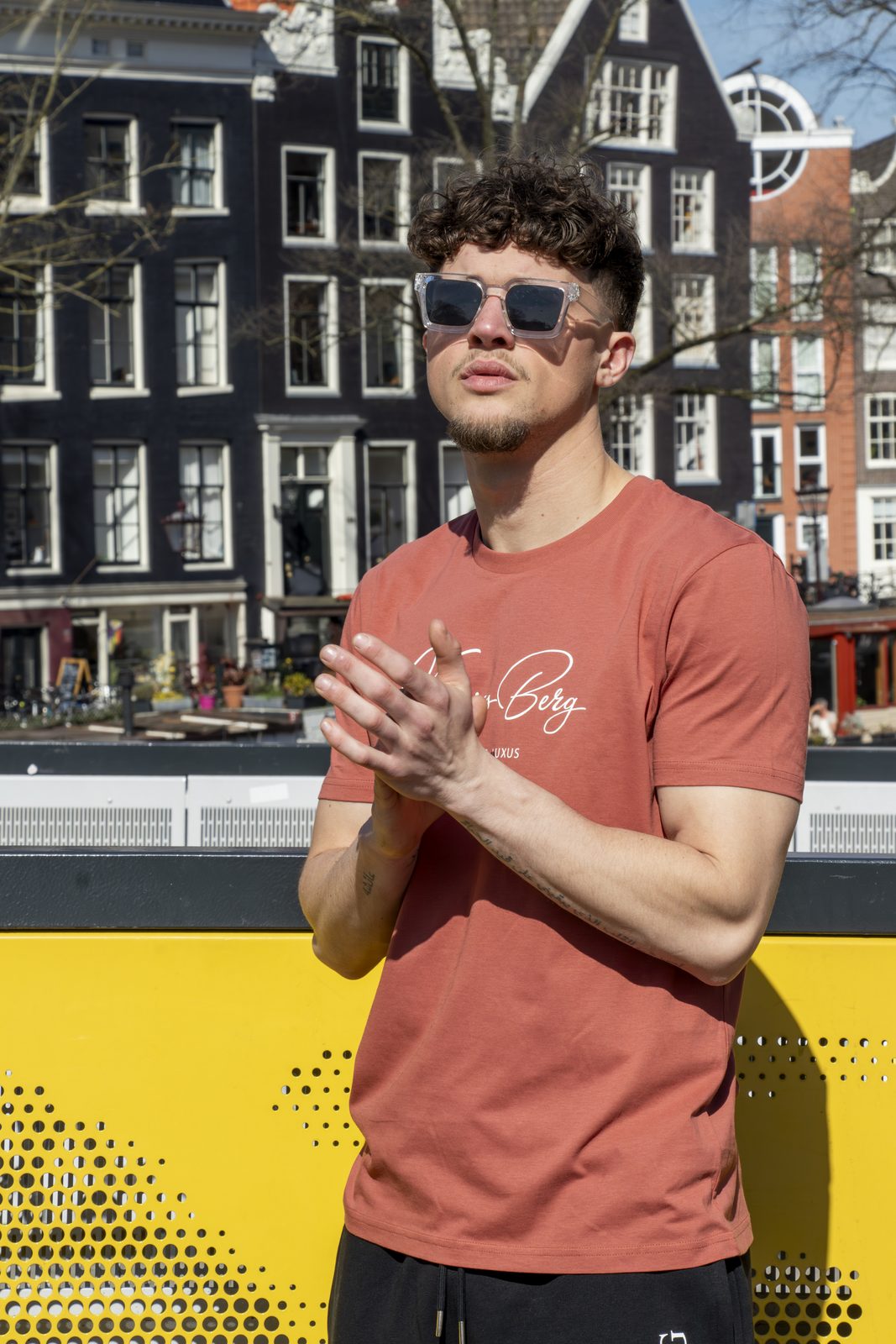 Model in a rust Kronigsberg tee by an Amsterdam canal
