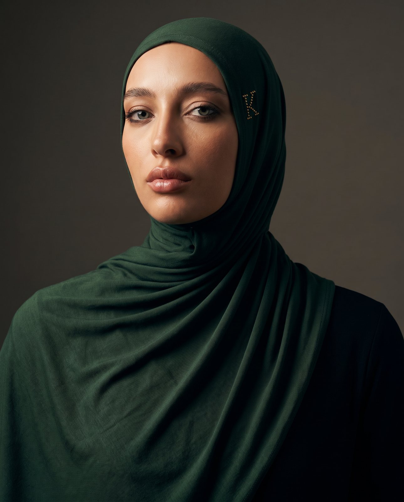 AI image: model in a deep-green hijab