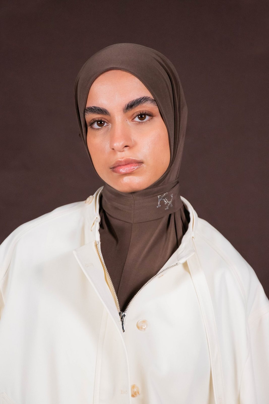 Portrait of the model in a brown hijab