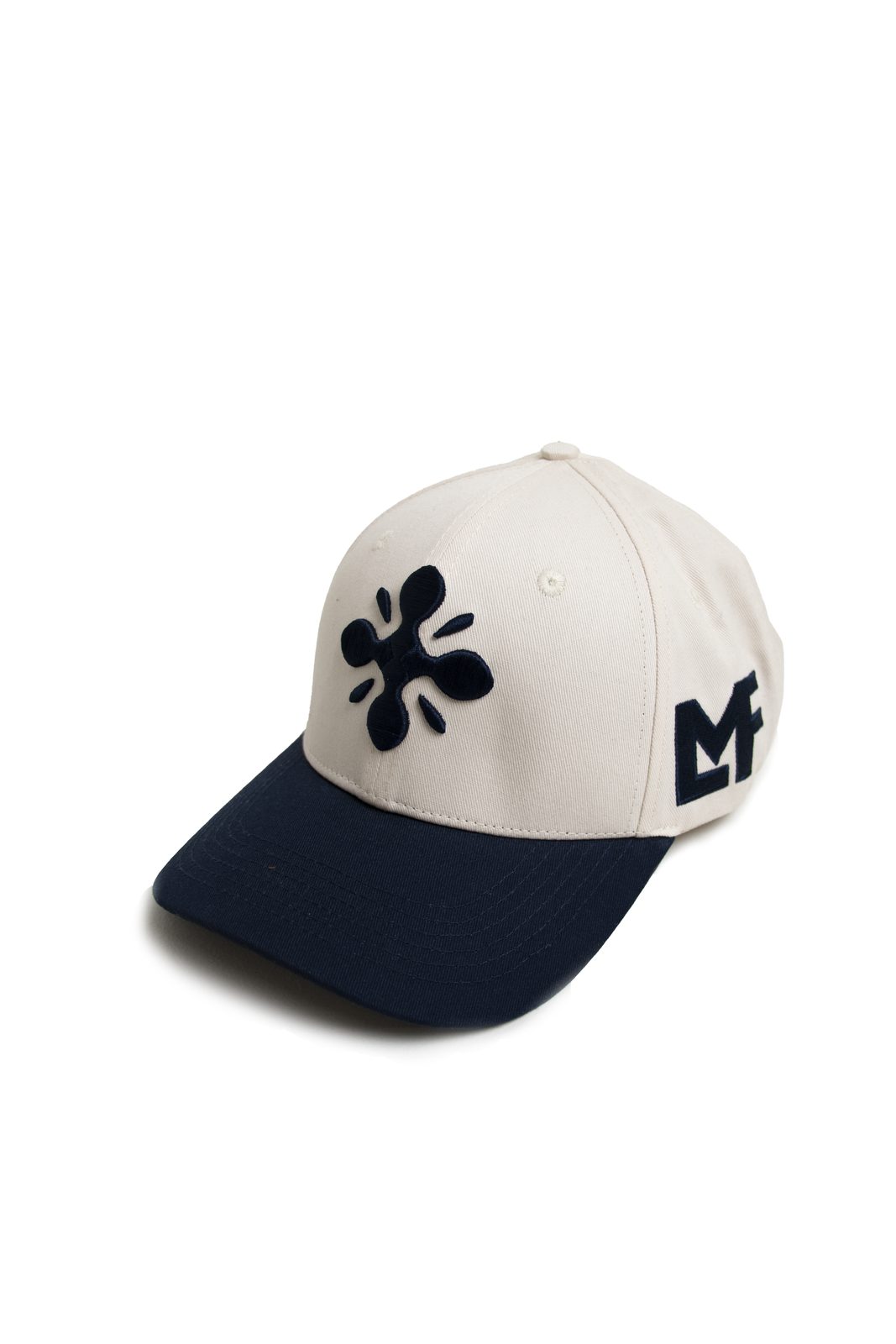 Cream LMF cap with a navy peak and logo