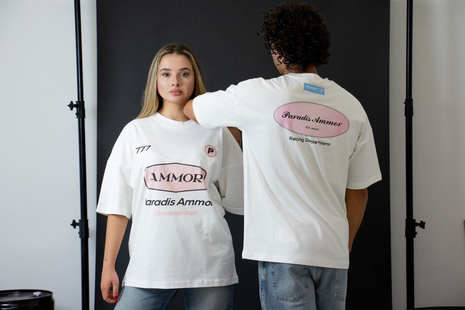 Front and back of two white Ammor tees on the racing set