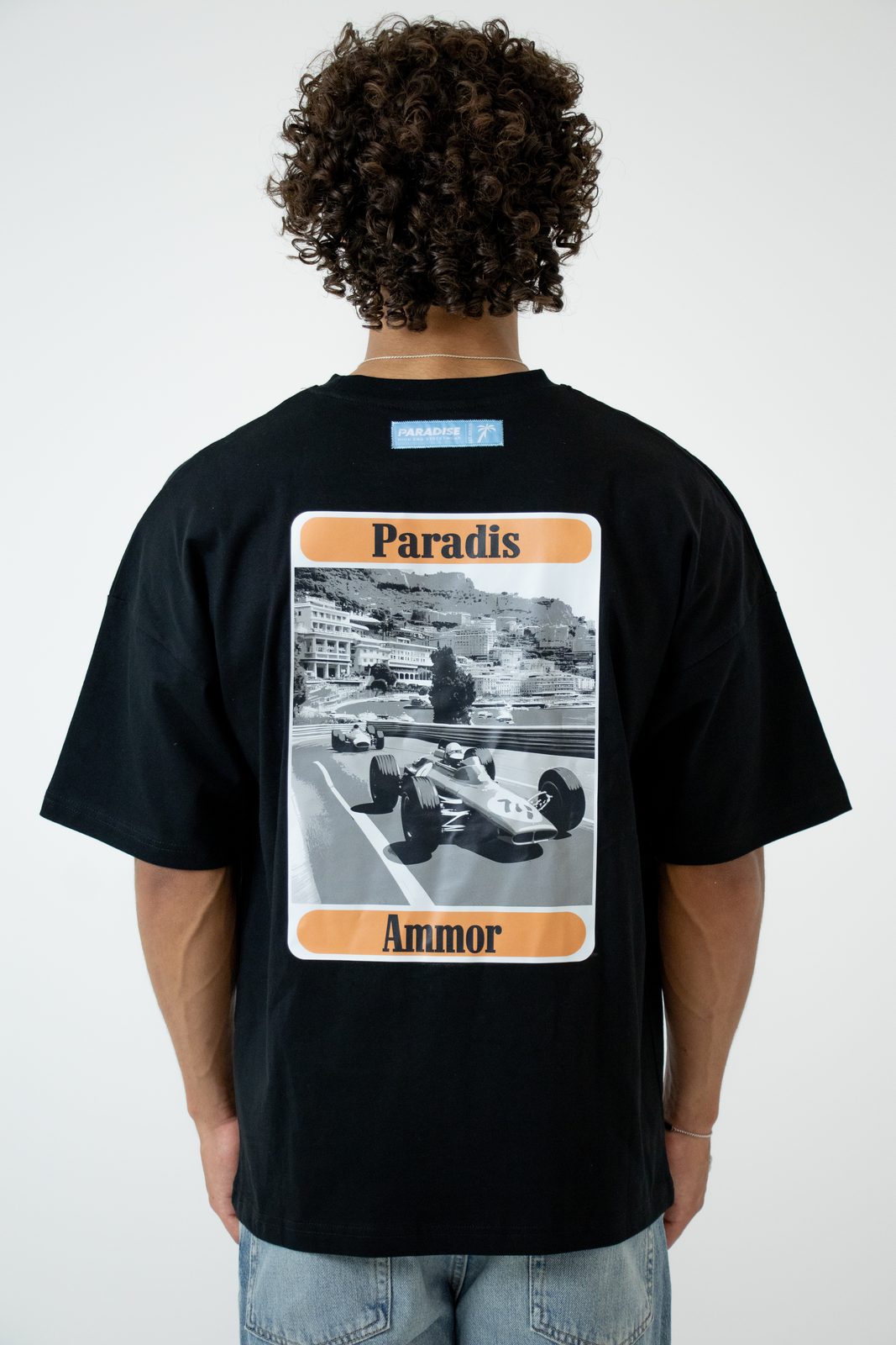 Back of a black tee with a vintage race-car photo print