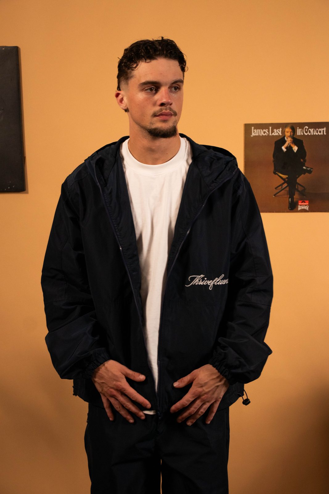 Model in a black Thrivefluence windbreaker