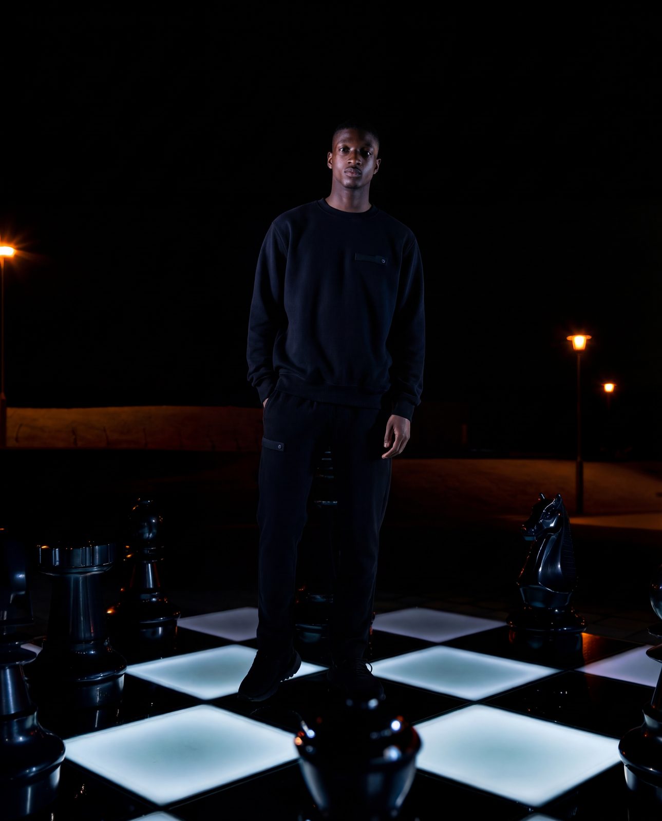 AI image: model on a glowing chessboard at night