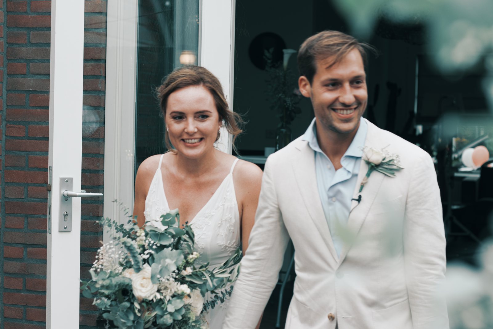 Imre and Chris arriving at the party hand in hand
